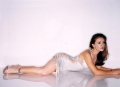 Alyssa Milano laying on the floor in great dress