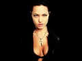 Angelina Jolie with silver cross between nice boobs