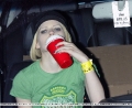 Avril Lavigne is drinking vodka from plastic cups