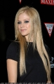 Avril Lavigne in a  black dress
