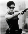 Carrie Anne Moss sexy dressed