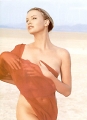 Charlize Theron posing on a desert