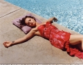 Christina Ricci in red lingerie laying by the swimming pool