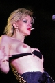 Courtney Love smoking and showing tits on  concert