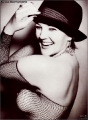 Drew Barrymore wearing hat in transparent dress