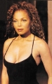 Janet Jackson in black sexy dress with plunging neckline