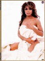 Janet Jackson posing in her bed