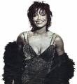 Janet Jackson posing in party dress