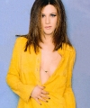 Jennifer Aniston wearing yellow sexy coat with nice neckline