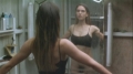 Jennifer Connelly posing in the mirror wearing only bra