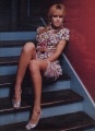 Jessica Alba posing on the stairs showing nice legs