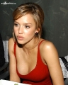 Jessica Alba wearing sexy red dress with a plunging neckline 