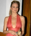 Jewel Kilcher posing in sexy dress with plunging neckline
