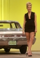 Jewel Kilcher showing awesome legs by her car