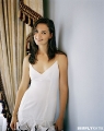 Katie Holmes posing in white dress with sexy neckline