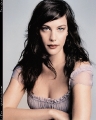 Liv Tyler posing in sexy dress with plunging neckline