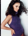 Natalie Portman posing in violet nice dress