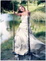 Reese Witherspoon posing in gorgious dress on the seesaw