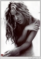 Shakira posing topless