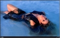 Shakira wearing hot dress posing in the water