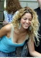 Shakira wearing blue shimmy with deep neckline