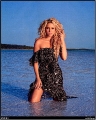 Shakira posing in the water