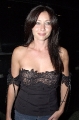 Shannen Doherty wearing black hot dress with awesome neckline