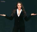 Stephanie McMahon posing in black sexy dress  