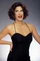 Teri Hatcher smiling wearing hot dress with plunging neckline