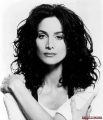 Carrie Anne Moss with curly hair