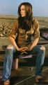 Kate Beckinsale posing  in brown shirt