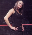Stephanie McMahon wearing black hot dress