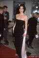 Carrie Anne Moss in black dress