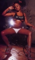 Lil Kim posing in sexy lingerie