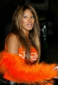 Traci Bingham wearing hot orange dress