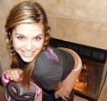 Teen Topanga warming up by the fireplace