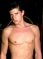 Simon Rex posing shirtless